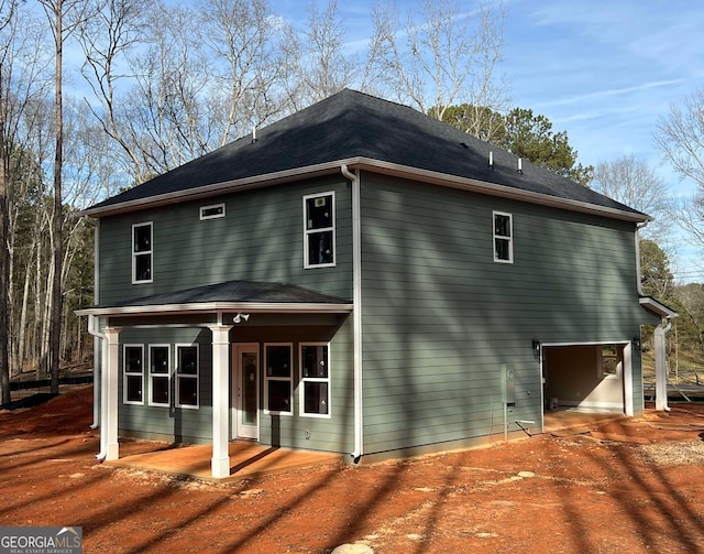 view of side of home featuring a garage