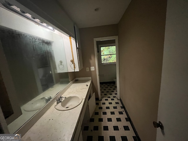 bathroom with vanity and toilet