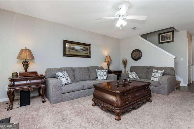 living room with ceiling fan and light carpet