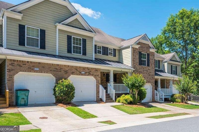 view of front of home featuring a porch and a garage