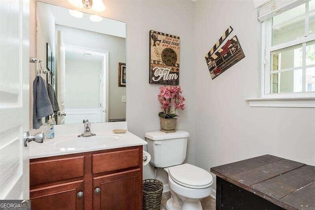 bathroom featuring vanity and toilet