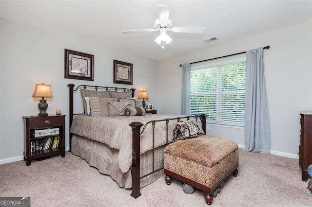 carpeted bedroom with ceiling fan