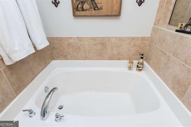 bathroom featuring a tub to relax in