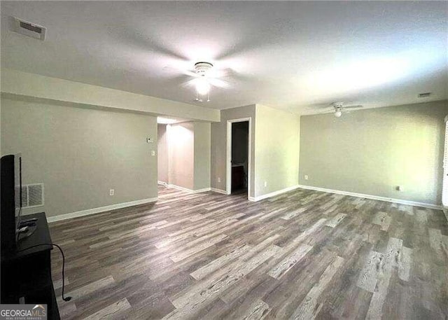 unfurnished living room with dark hardwood / wood-style flooring