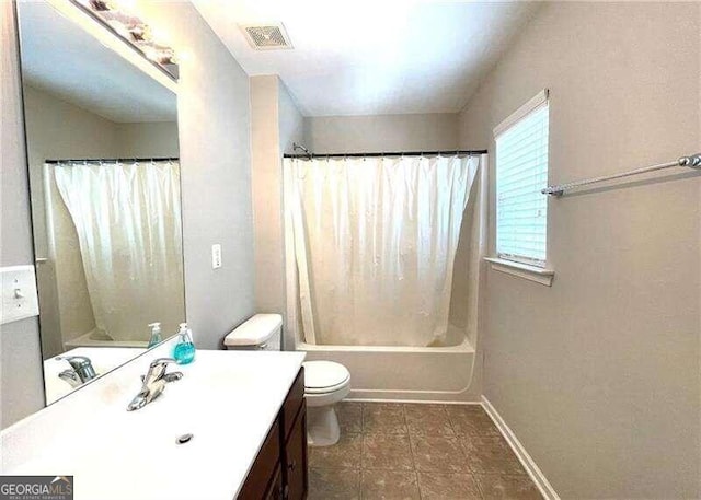 full bathroom featuring tile patterned flooring, vanity, shower / bath combination with curtain, and toilet