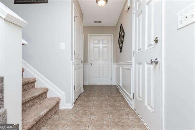 hallway with light tile patterned floors