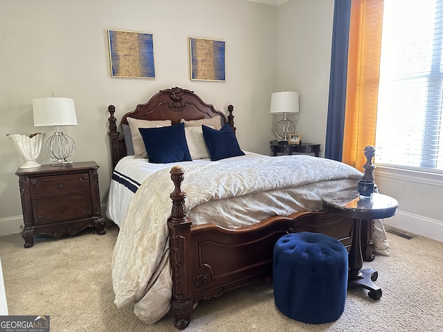 bedroom featuring light colored carpet