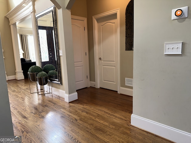 corridor featuring dark hardwood / wood-style floors