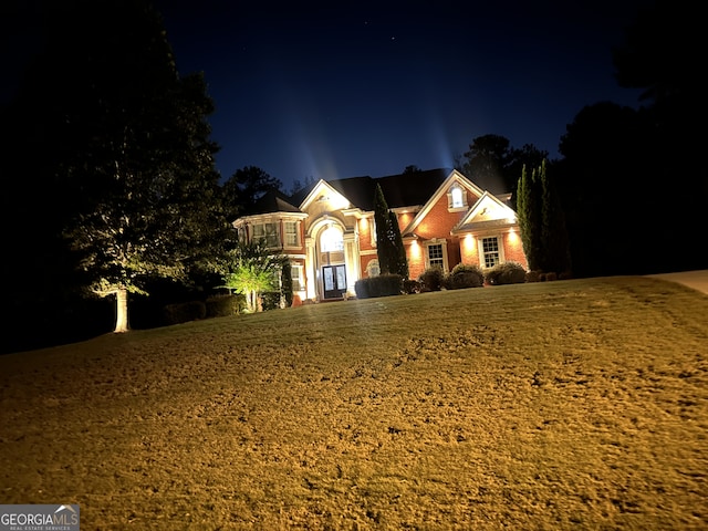 view of front of home with a yard