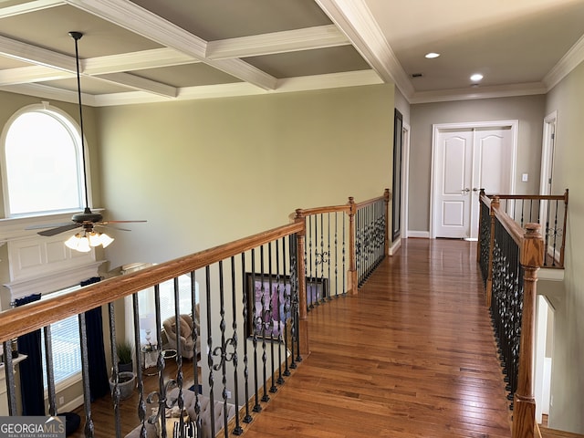 hall with beamed ceiling, ornamental molding, dark hardwood / wood-style flooring, and coffered ceiling