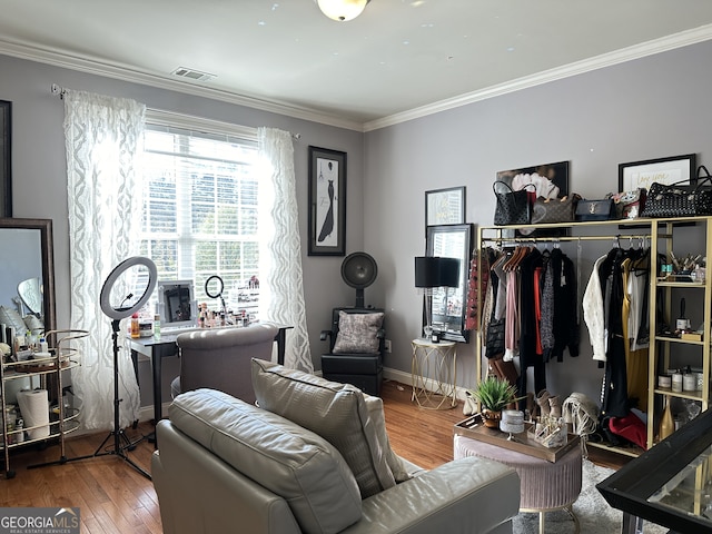 interior space featuring hardwood / wood-style floors and ornamental molding