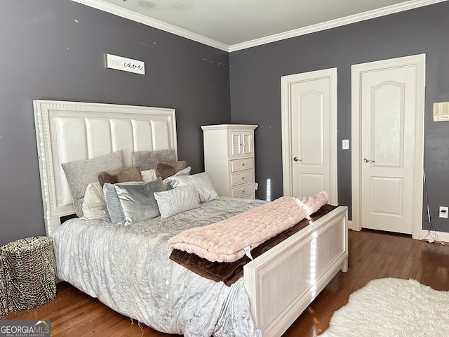 bedroom featuring dark hardwood / wood-style floors and crown molding