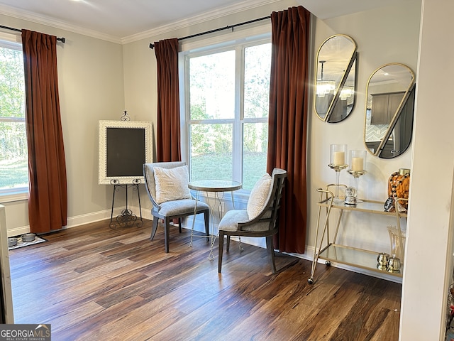 sitting room featuring plenty of natural light, ornamental molding, and dark wood-type flooring