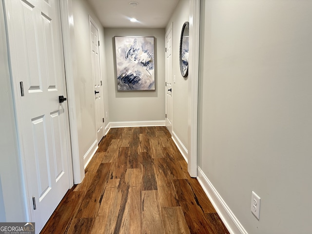 hall with dark hardwood / wood-style flooring