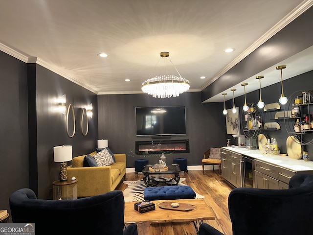 interior space featuring a chandelier, ornamental molding, wine cooler, and light hardwood / wood-style flooring