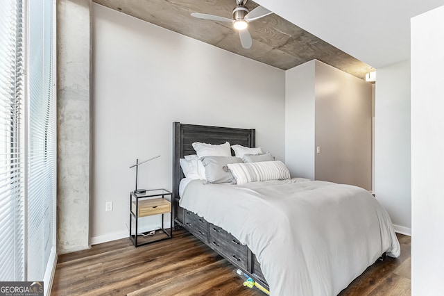 bedroom with ceiling fan and dark wood-type flooring