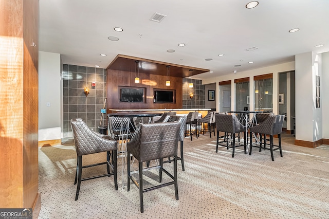 dining room with light colored carpet