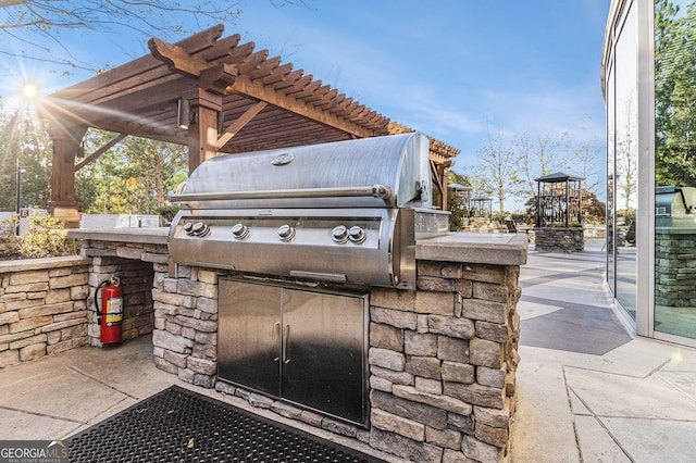 view of patio featuring a grill and exterior kitchen