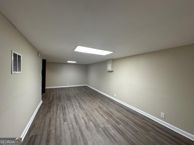 3691 Fred Walker Dr SW, Smyrna, GA 30082 - finished below grade area featuring dark wood-style floors and baseboards