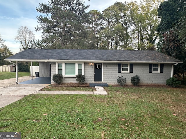 ranch-style home featuring a front yard and a carport