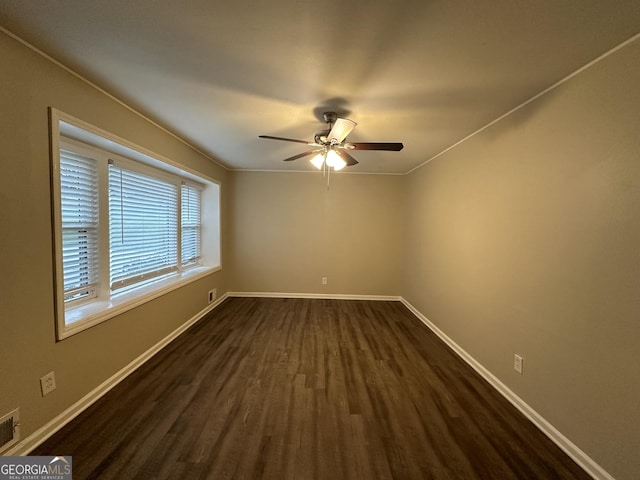 3691 Fred Walker Dr SW, Smyrna, GA 30082 - empty room featuring dark wood finished floors, a ceiling fan, and baseboards