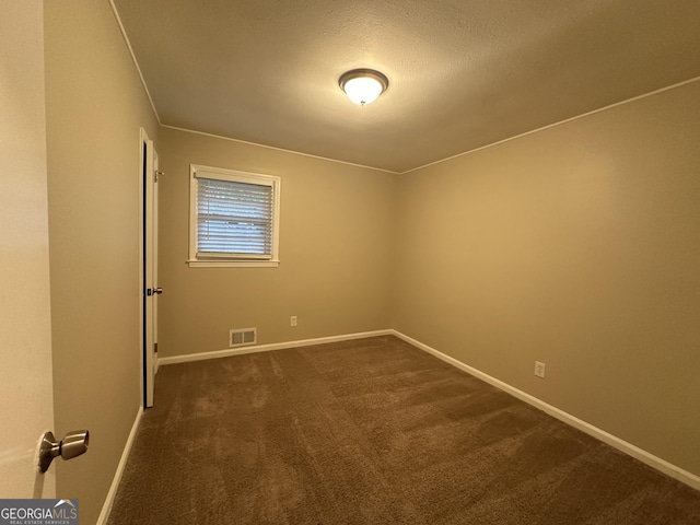 3691 Fred Walker Dr SW, Smyrna, GA 30082 - empty room featuring dark carpet, baseboards, and a textured ceiling