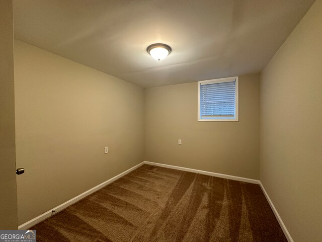 unfurnished room featuring carpet floors