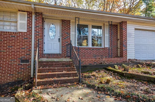 property entrance with a garage