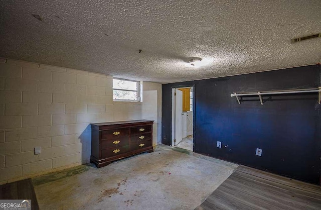 interior space with a textured ceiling