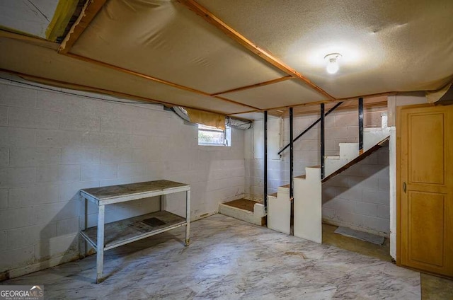 basement with a textured ceiling