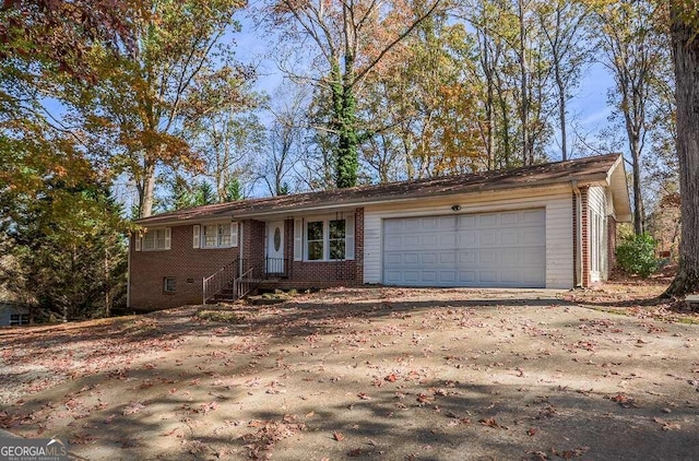 ranch-style house featuring a garage