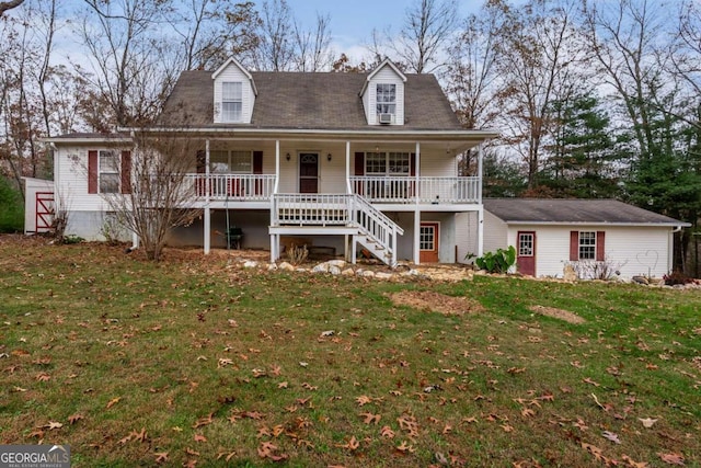 cape cod house featuring a front yard and covered porch