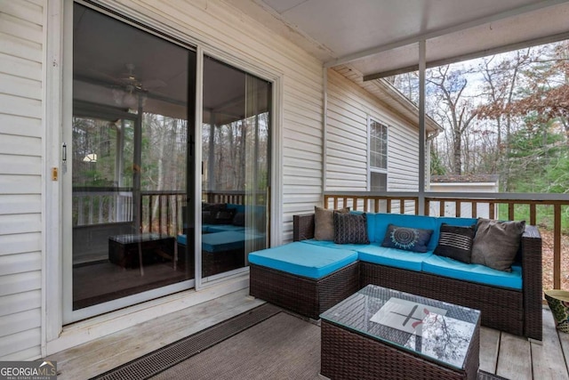 sunroom / solarium with a wealth of natural light and ceiling fan