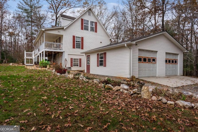 exterior space featuring a garage and a front lawn