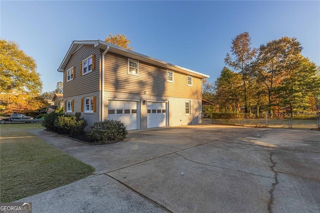 view of property exterior with a garage