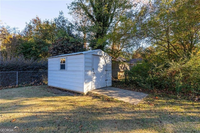 view of outdoor structure with a lawn