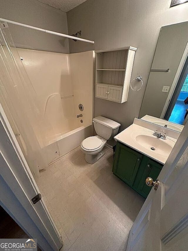 full bathroom featuring vanity, shower / bathtub combination, and toilet