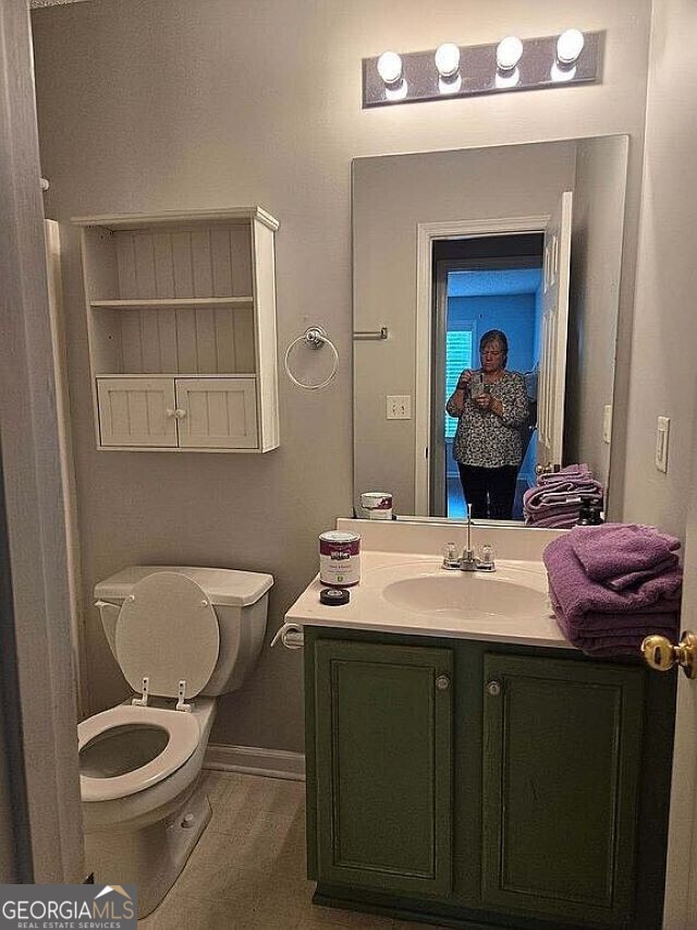 bathroom with vanity and toilet