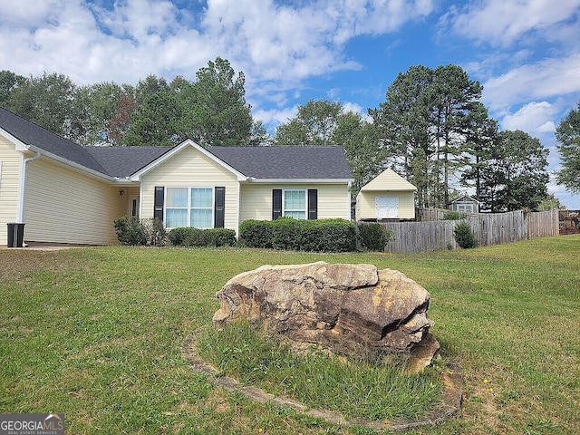 single story home with a front lawn