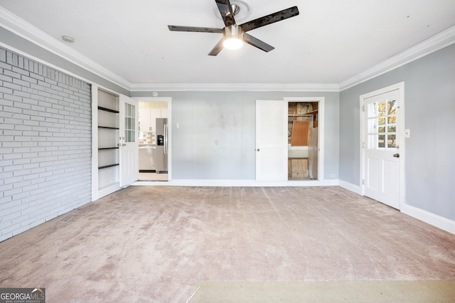 1396 Gale Dr, Norcross, GA 30093 - unfurnished bedroom featuring light colored carpet, brick wall, ornamental molding, stainless steel refrigerator with ice dispenser, and ceiling fan