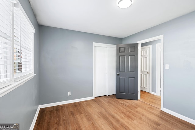 1396 Gale Dr, Norcross, GA 30093 - unfurnished bedroom featuring light wood-type flooring and a closet