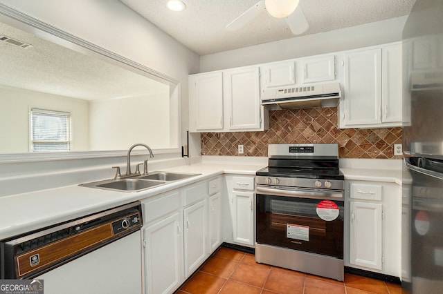 kitchen featuring appliances with stainless steel finishes, white cabinets, sink, and range hood