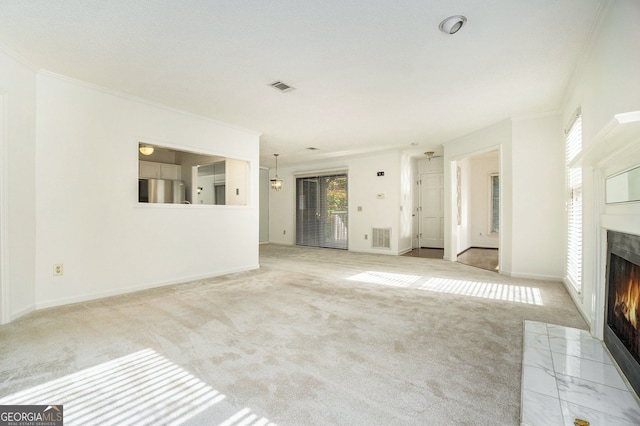 unfurnished living room featuring light carpet and ornamental molding