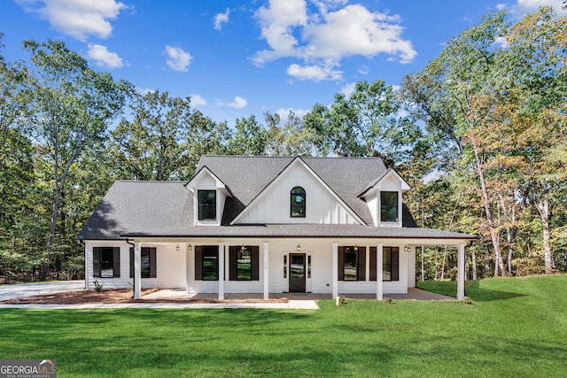 rear view of property with a yard