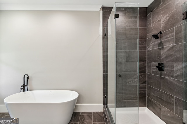 bathroom featuring separate shower and tub