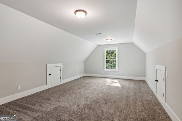 bonus room with carpet and lofted ceiling