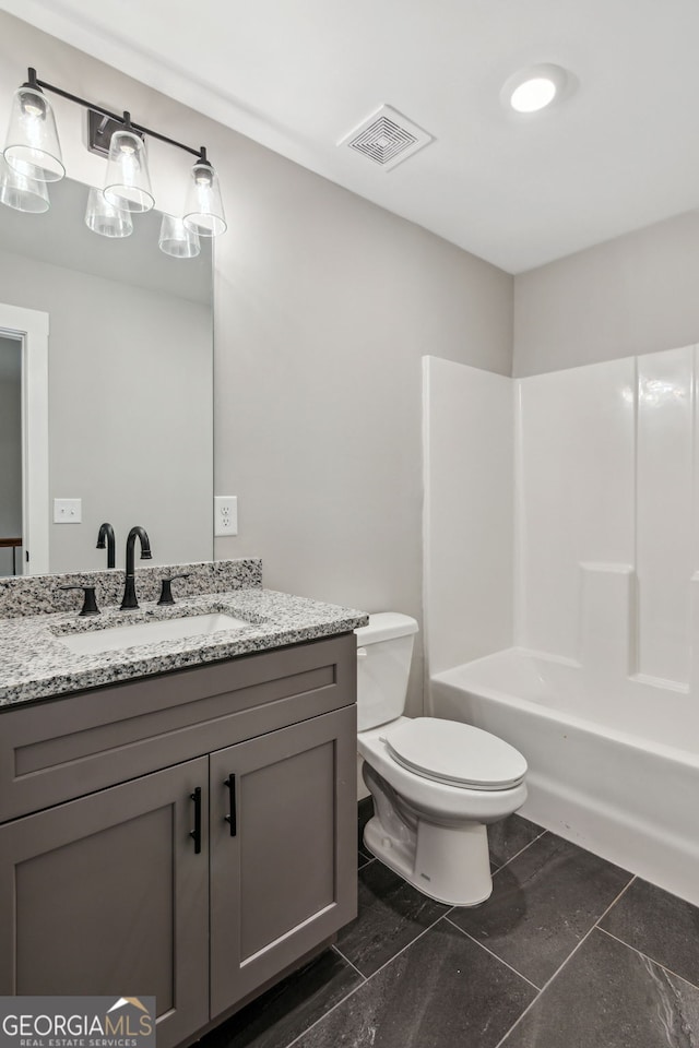 full bathroom featuring tile patterned flooring, vanity, toilet, and shower / washtub combination