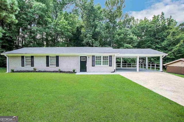 ranch-style house featuring a carport and a front lawn