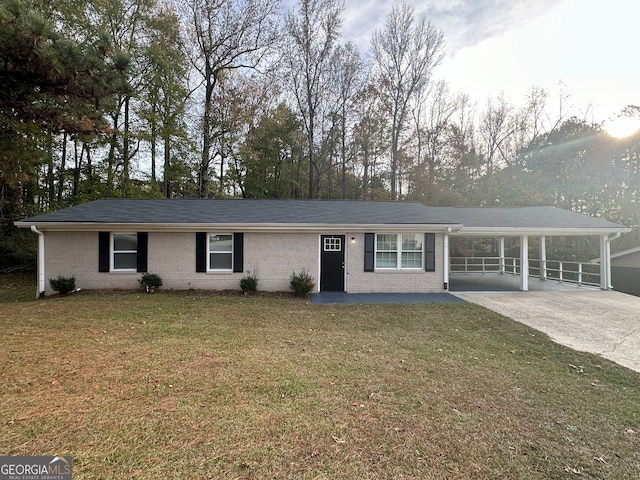 ranch-style home featuring a front yard and a carport