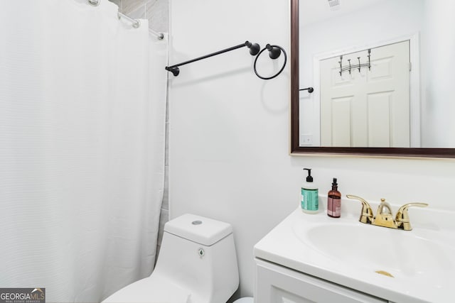 bathroom with vanity and toilet